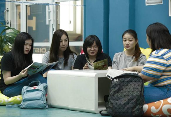 International students enjoy some light reading at DISTED Library